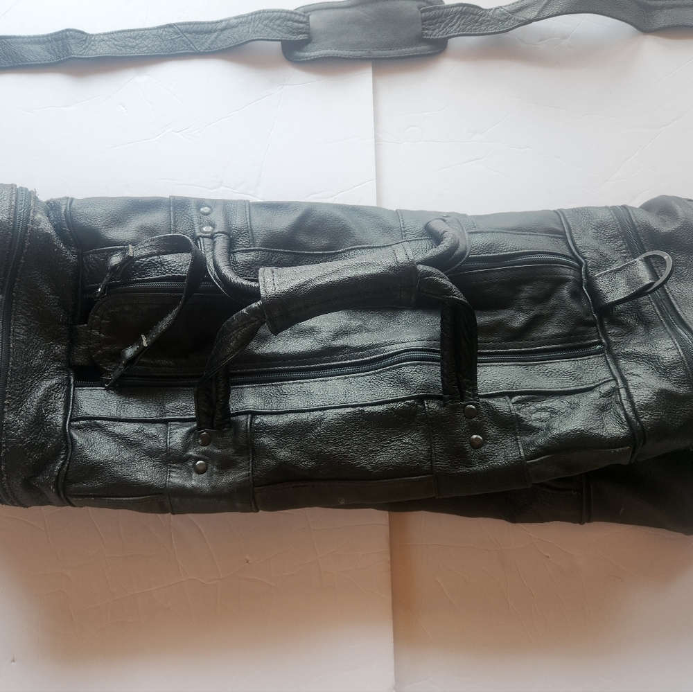 Spacious Black Leather Duffel Bag with Glossy Finish